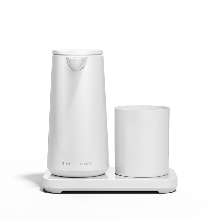 Low-angle view: Simplehuman White Foam Sensor Pump and Cup set on drip-free base.