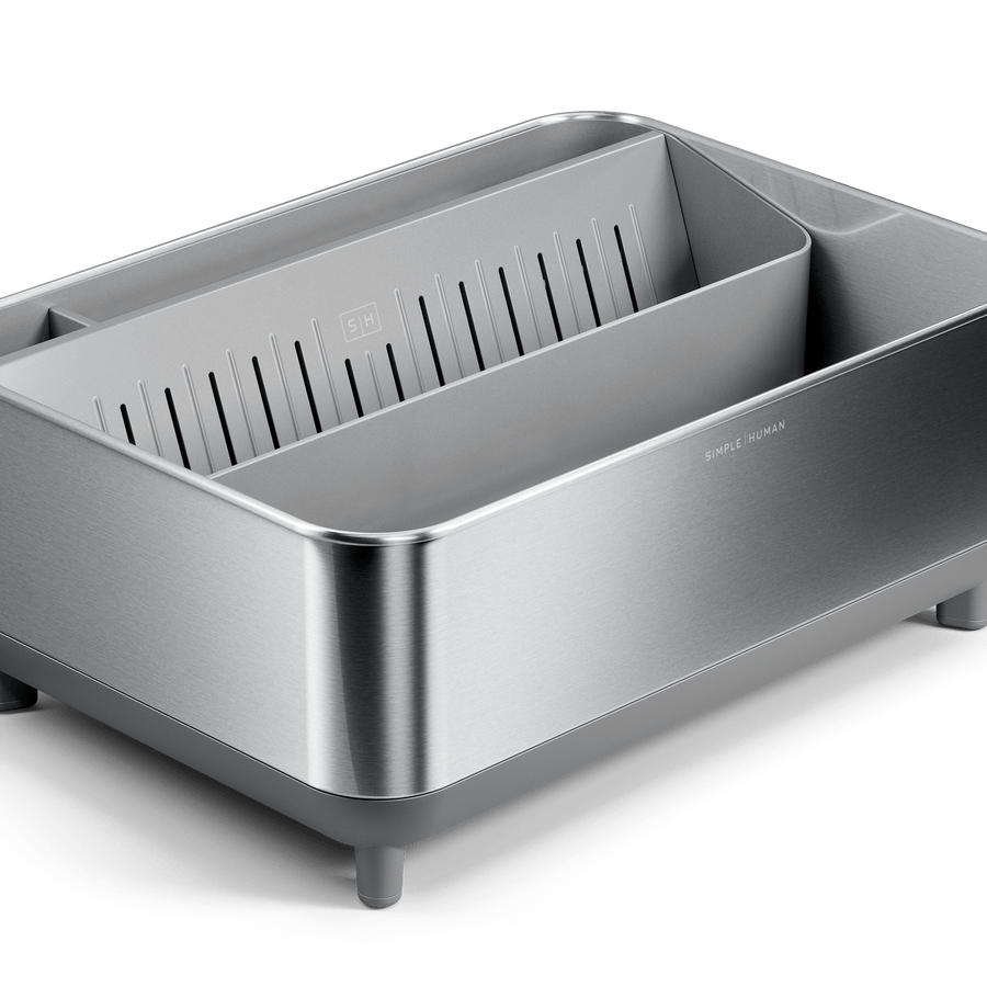 Close-up of Simplehuman Brushed stainless steel Bottle Dock with gray base and removable inner tray, detail view.