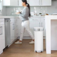 45L slim step can - white steel - lifestyle woman in background in kitchen