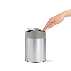 mini can - brushed stainless steel w/ grey trim - lifestyle with hand image