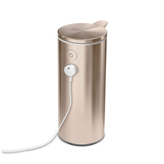 rechargeable liquid soap sensor pump - rose gold finish - charger on pump image