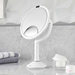sensor mirror trio - white finish - lifestyle mirror on counter with makeup pads